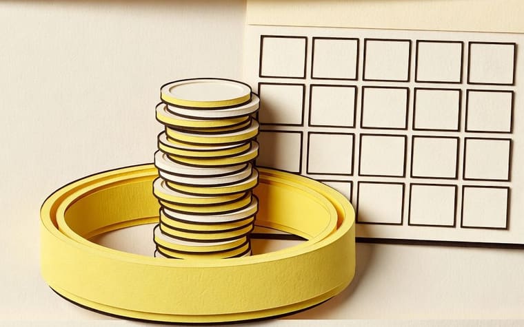 Paper craft illustration of a jeweller welcoming a customer at a counter on the day a savings scheme matures, with a jewellery tray and a phone showing a completed statement